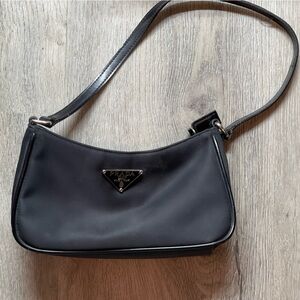 Prada Black Pouchette.. never actually used more than once.  Super cute!